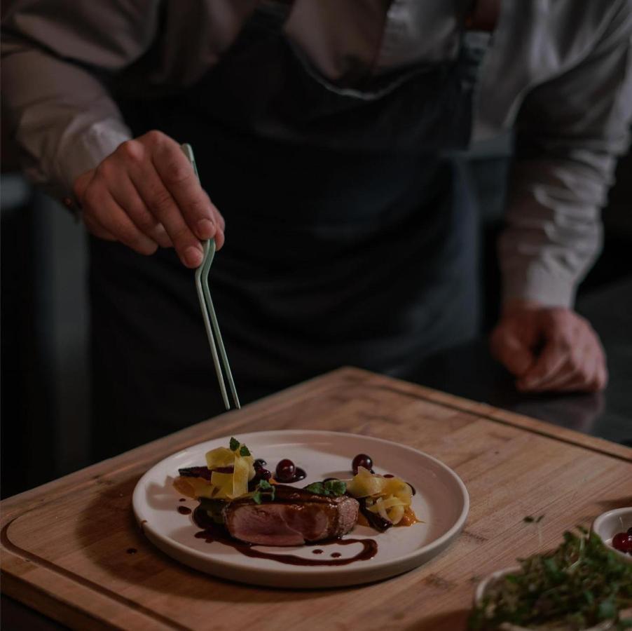 Century Marina Hotel - Lusail 외부 사진 A chef plating a dish